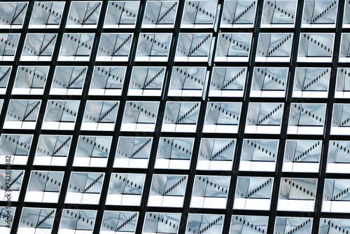 rows of modern windows, reflection on modern city building, interesting pattern in daily life, blue, white and black repeatative pattern