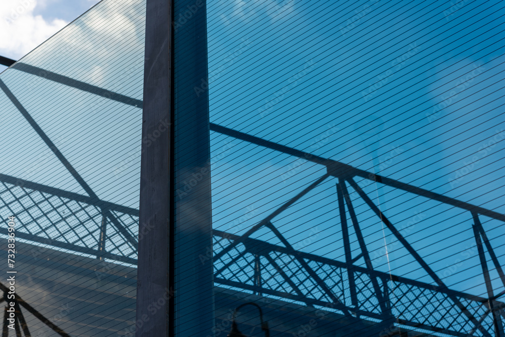 footbridge mostly behind protective glass and steel barrier fence footbridge mostly behind protective glass and steel barrier fence