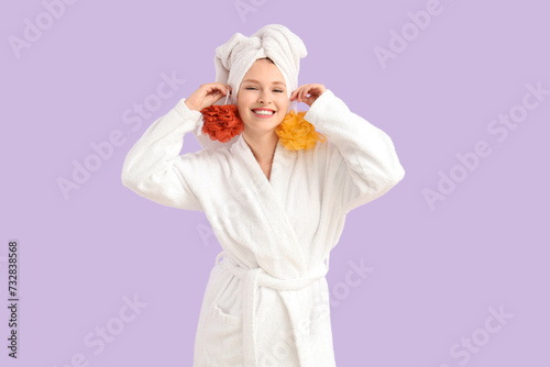 Young woman in bathrobe wit...