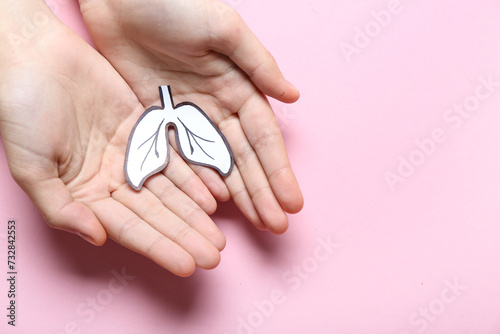 Female hands with paper lun...