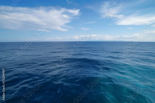 A vast expanse of blue sea stretching to the horizon. Generative AI © Harper
