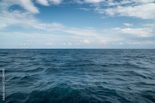 A vast expanse of blue sea stretching to the horizon. Generative AI © Marisela