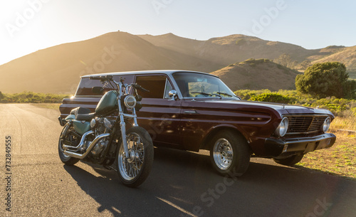 car during sunset with motorcycle