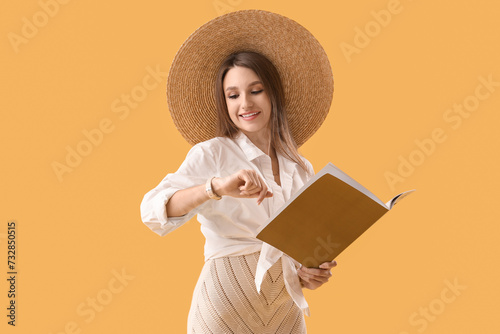 Young woman with magazine l...