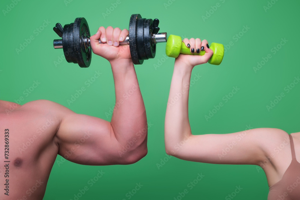 Dumbbell workout. Male and female hands with dumbbells close-up. Training muscles. Female and male hand holds dumbbell. Muscular hands, exercises with dumbbells. Strong Dumbbell. Fitness and Sport. Dumbbell workout. Male and female hands with dumbbells close-up. Training muscles. Female and male hand holds dumbbell. Muscular hands, exercises with dumbbells. Strong Dumbbell. Fitness and Sport.