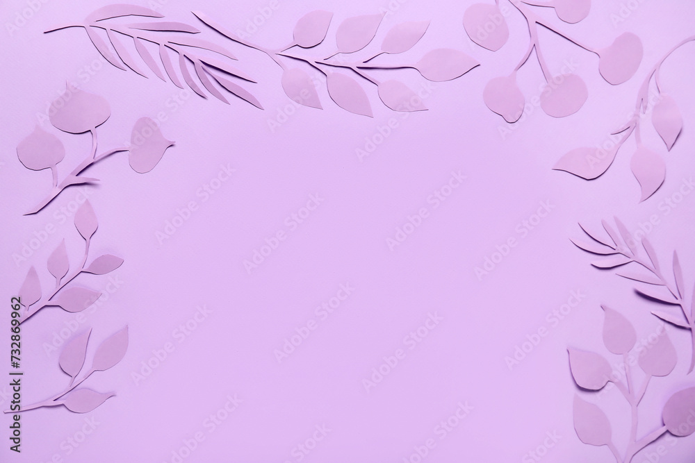 Frame made of paper leaves on purple background Frame made of paper leaves on purple background