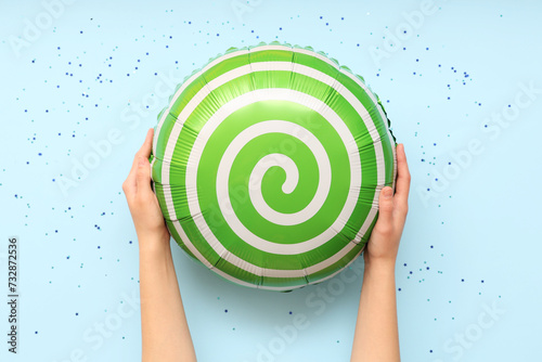 Hands holding green swirl f...