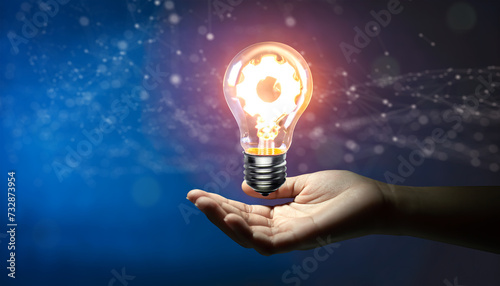 Hand holding Creative light bulb with cog inside and technology background. Innovation business idea knowledge, Planing strategy, and Analysis solution development Concept. Generative AI. photo