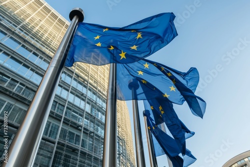 Fluttering EU flag in front of glass building