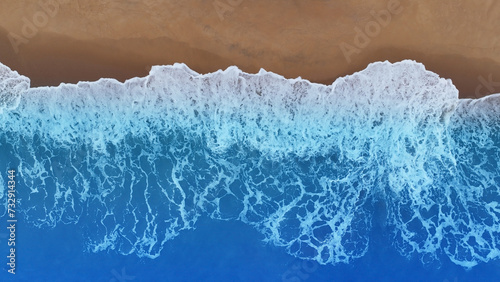 The soft wave water of the sea on the sandy beach background