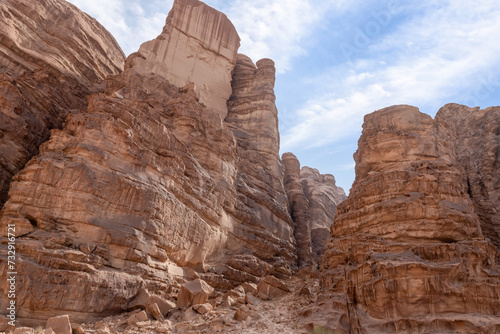 High mountains with the abundance of the varied shapes surround the endless desert of the Wadi Rum near Amman in Jordan