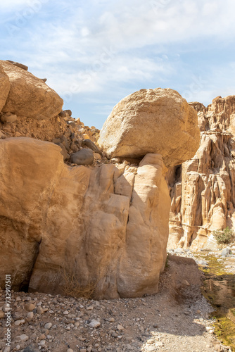 Huge boulders on tourist route of the gorge Wadi Al Ghuwayr or An Nakhil and the wadi Al Dathneh near Amman in Jordan