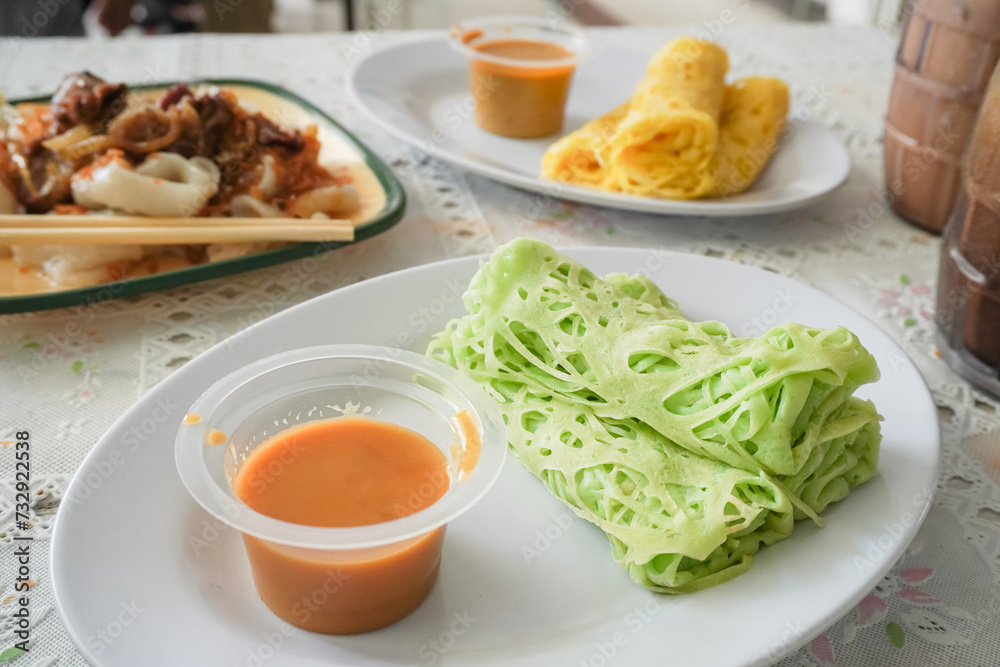 Roti jala is a typical Malay food in North Sumatra and served with curry sauce. Usually served as a takjil menu during the month of Ramadan.