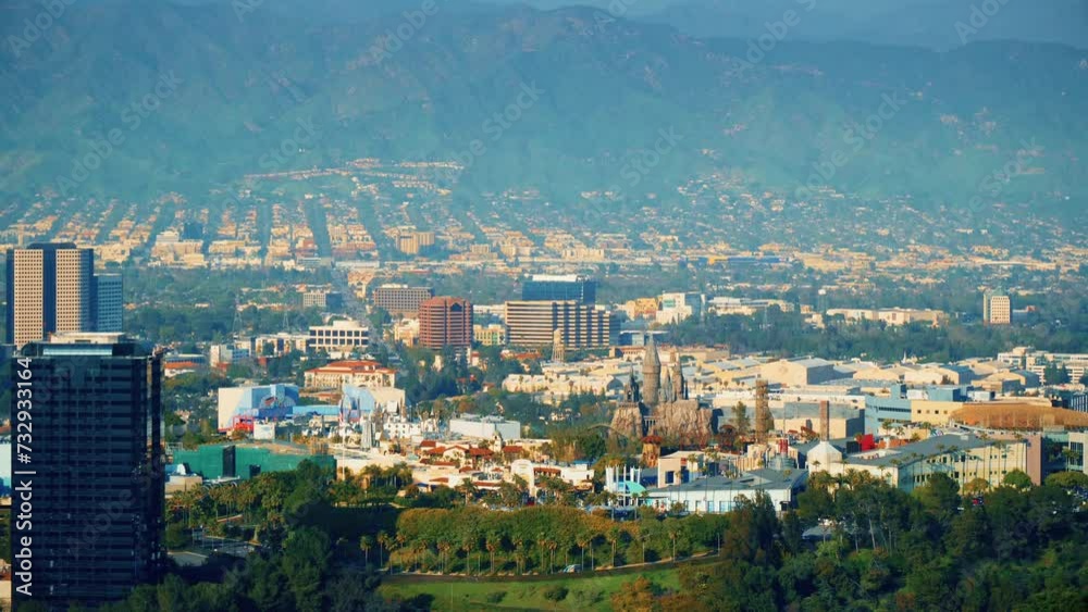 Studio City, California, United States – April 16, 2019: Universal Citywalk overlook. Hogwarts Cattle. Universal City Theme Park aerial view. Breathtaking look on city from the hills in slow motion. Studio City, California, United States – April 16, 2019: Universal Citywalk overlook. Hogwarts Cattle. Universal City Theme Park aerial view. Breathtaking look on city from the hills in slow motion.