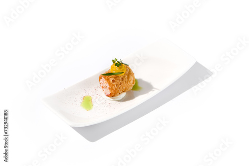 Crunchy crabmeat cannoli on a sleek white dish with a citrus accent, perfect for refined appetizers and modern cuisine
