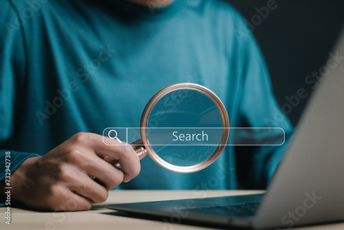 SEO search engine optimization concept, Person using laptop with search bar. Marketing ranking traffic website, internet technology for business company.