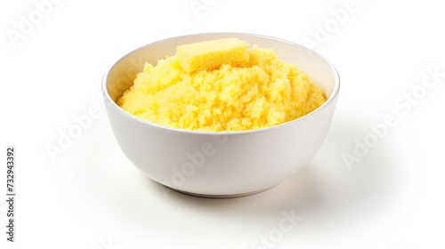 Bowl of yellow corn porridge isolated on white background with clipping path