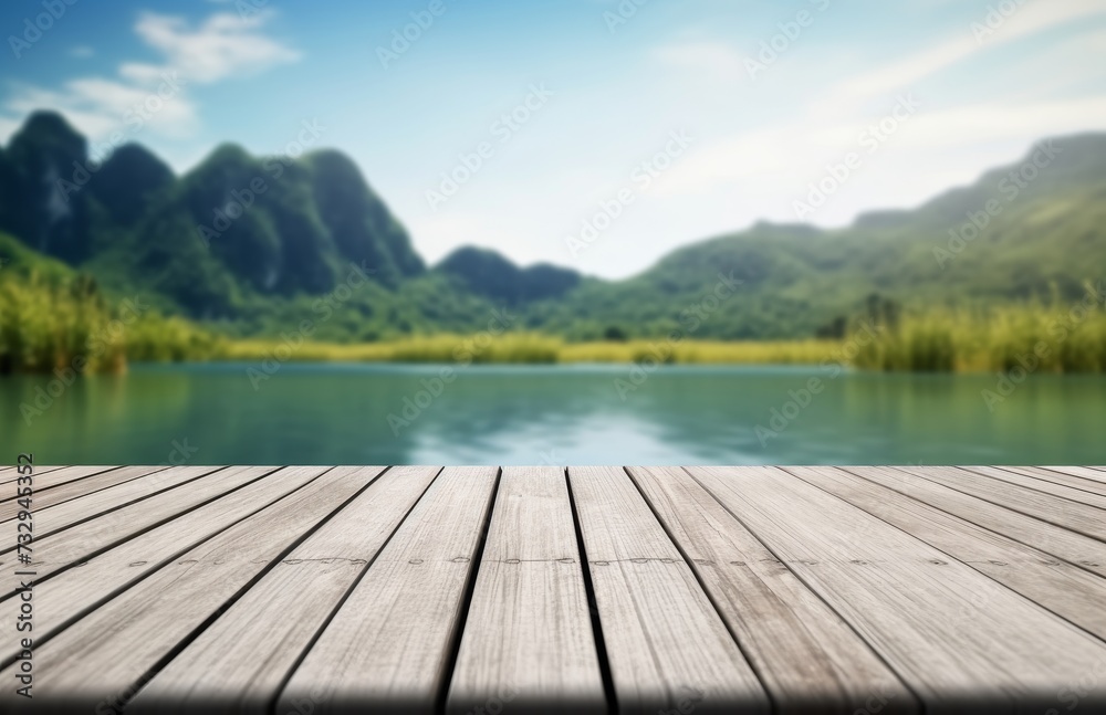 Empty old wooden table in front of blurred background of the lake, blue sky