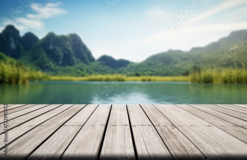 Empty old wooden table in front of blurred background of the lake  blue sky