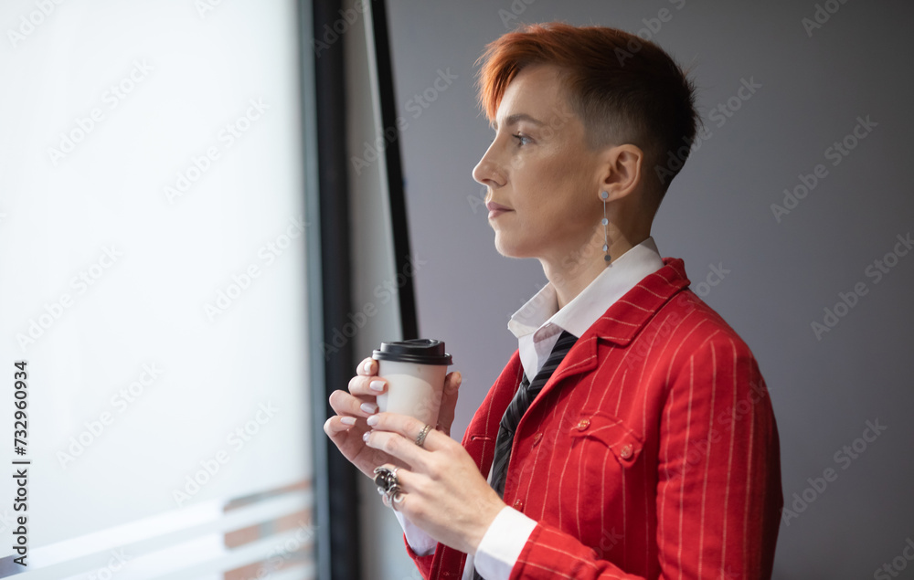 Trendy business woman in red suit work hold takeaway delivery craft paper cup coffee. Trendy business woman in red suit work hold takeaway delivery craft paper cup coffee.