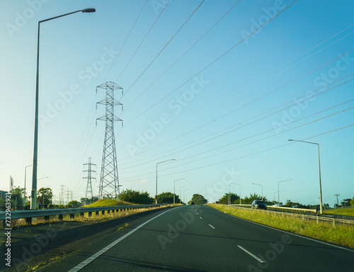 Transmission towers and power lines along the motorway. Auckland.