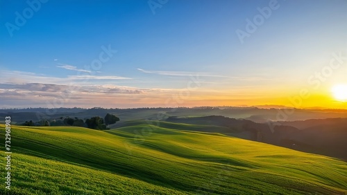 Beautiful view on green hills at sunrise  summer rural landscape