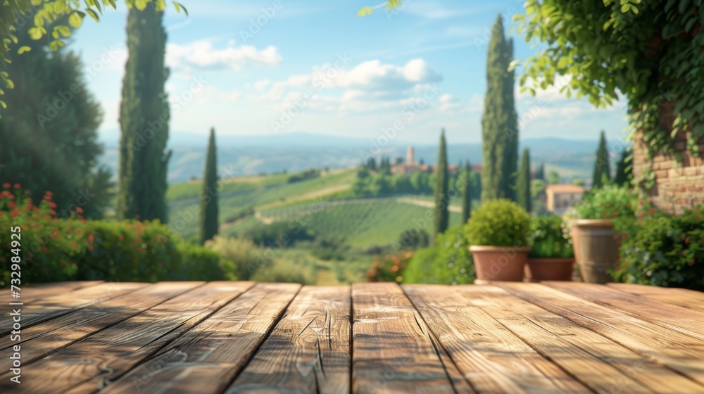 An empty wooden table for product display. Blurred french vineyard in the background An empty wooden table for product display. Blurred french vineyard in the background