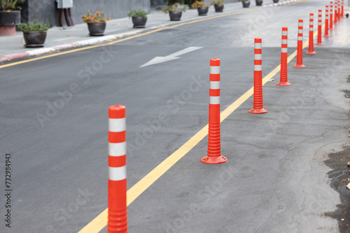 Wallpaper Mural plastic bollards with white reflective tape on ground floor. orange bollards traffic equipments. Torontodigital.ca