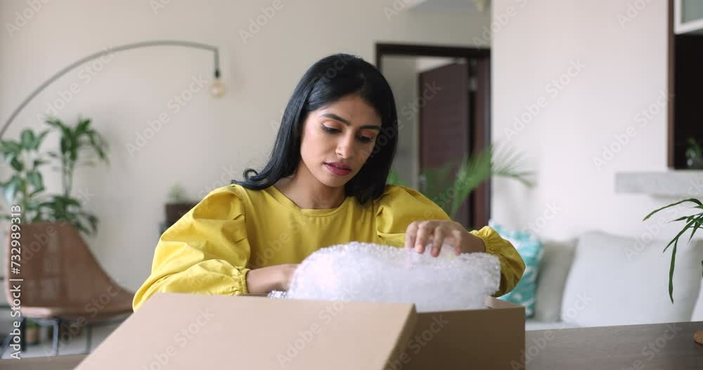 Indian woman got parcel with damaged items. Female open received package box with ordered goods feels frustrated, wrong not meeting expectations. E-commerce, replace, refund, cancel, negative feedback Indian woman got parcel with damaged items. Female open received package box with ordered goods feels frustrated, wrong not meeting expectations. E-commerce, replace, refund, cancel, negative feedback