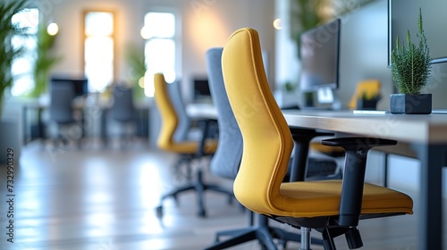 A series of striking yellow office chairs stand out in a well-lit modern office space  enhancing the energetic and creative atmosphere.