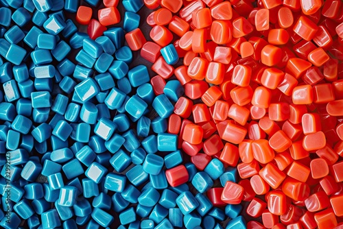 Dyed synthetic polymer resins granulates. Recycled plastic granules with mixed colors photo