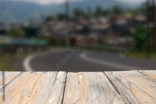 photo of a wooden board with a blurred street view in the background