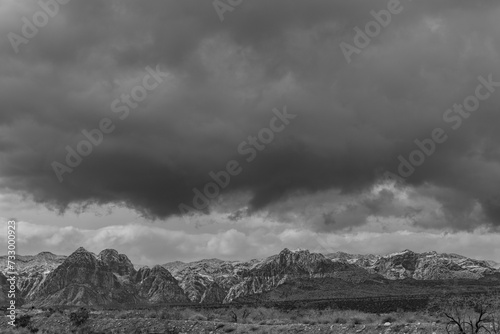 clouds over mountains in black and white