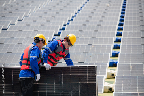 Wallpaper Mural Photovoltaic engineers work on floating photovoltaics. Inspect and repair the solar panel equipment floating on the water. Torontodigital.ca