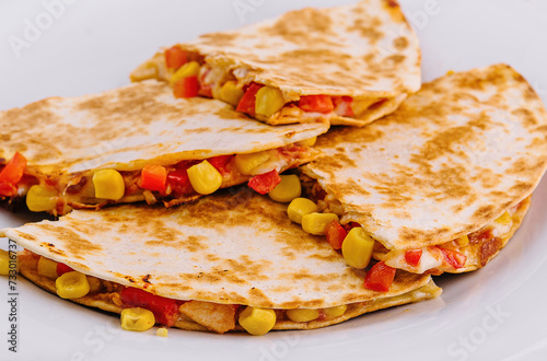 Mexican quesadilla with vegetables on plate
