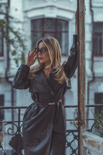 Spring - Autumn collection. Blonde woman in leather coat on a city background. Modern classical ladies wardrobe © T.Den_Team