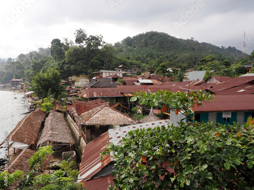 Market roofs above Lau Bohorok river, Bukit Lawang Sumatra, Indonesia photo
