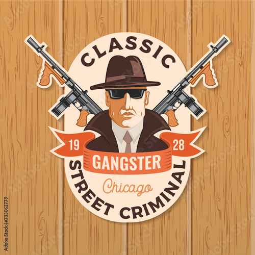 Classic gangster. Street criminal badge design. Vector illustration. Vintage monochrome label, sticker, patch with silhouette of a gangster and submachine gun.