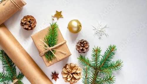 christmas composition craft gift box small tree branches and craft diy decorations on white background new year concept christmas home decoration flat lay top view copy space