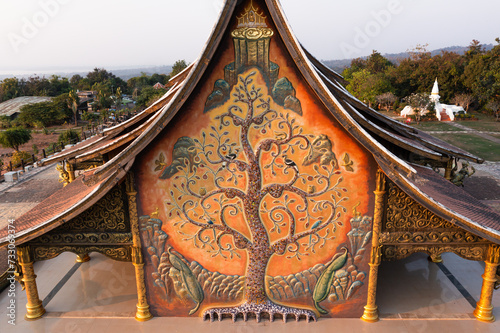 Aerial view of Wat Sirindhorn Wararam (Wat Phu Prao) Chong Mek, Sirindhorn District, Ubon Ratchathani Thailand, Beautiful Temple near the Thai-Laos Border town, Wat Temple at the evening	 photo