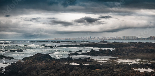 Dramatic Seascape with Rocky Foreground and SalvadorCity Skyline