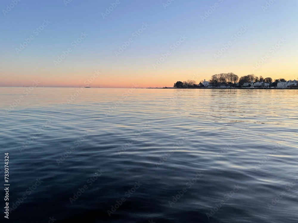 Scenic view of sunset over a tranquil lake at Bellevue Strand, Denmark