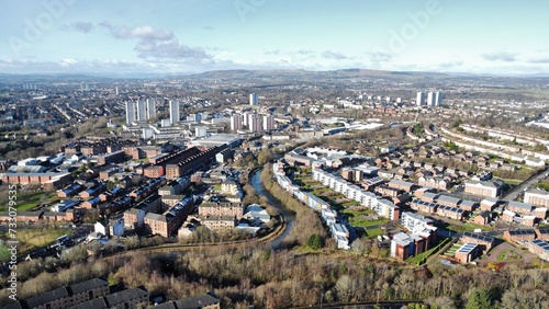Aerial cityscape showcasing houses and a meandering river. Maryhill, Glasgow, Scotland photo