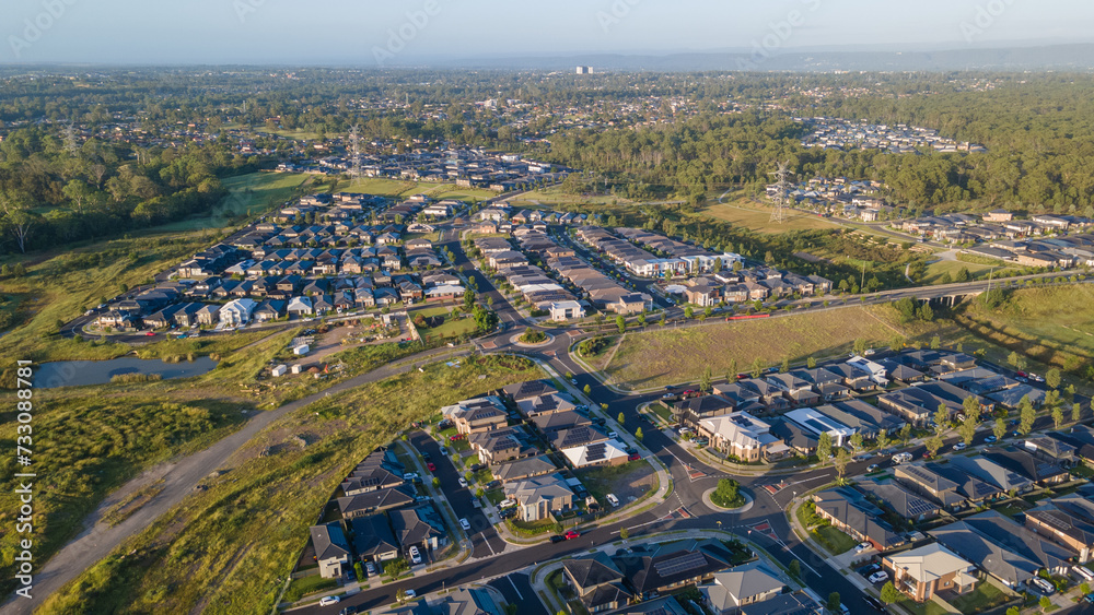 Aerial drone view of Jordan Springs East, known as the sinking suburb, in western Sydney, NSW Australia on a sunny morning in February 2024