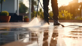 Close up worker cleaning driveway with pressure washer, professional cleaning service, Deep cleaning under high pressure.