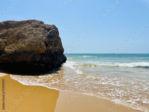 rocky coast of the ocean, rocks at the ocean beach, ocean horizon © Oksana