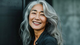 Cute Smiling Woman With Grey Hair. Beautiful Middle-Aged Asian Woman Portrait. Mature beautiful middle aged asian woman, senior older grey haired lady looking at camera.