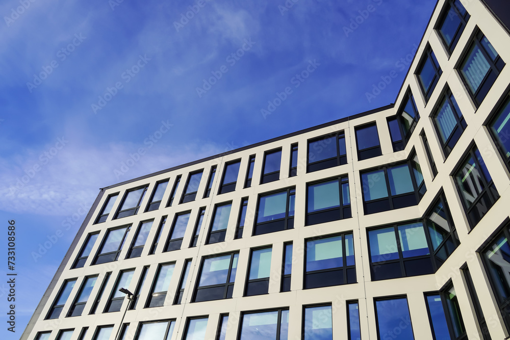 Look up to white building facade towards blue sky. Kopli, Tallinn, Estonia. February 2024 Look up to white building facade towards blue sky. Kopli, Tallinn, Estonia. February 2024