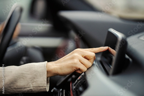 Close up of hand using gps in a car. © dusanpetkovic1
