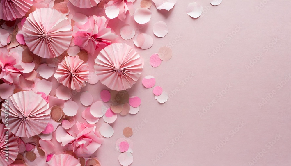 pink paper confetti on pastel background with copy space for text